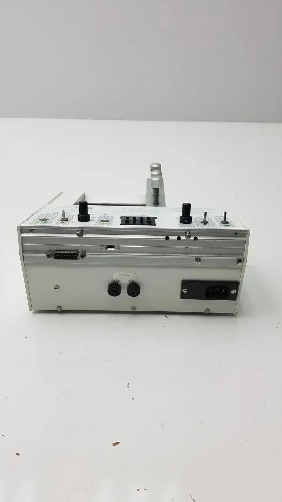 Silver metallic microinjection pump with black knobs and ports Carnegie Medicin AB model CMA 100 industrial device