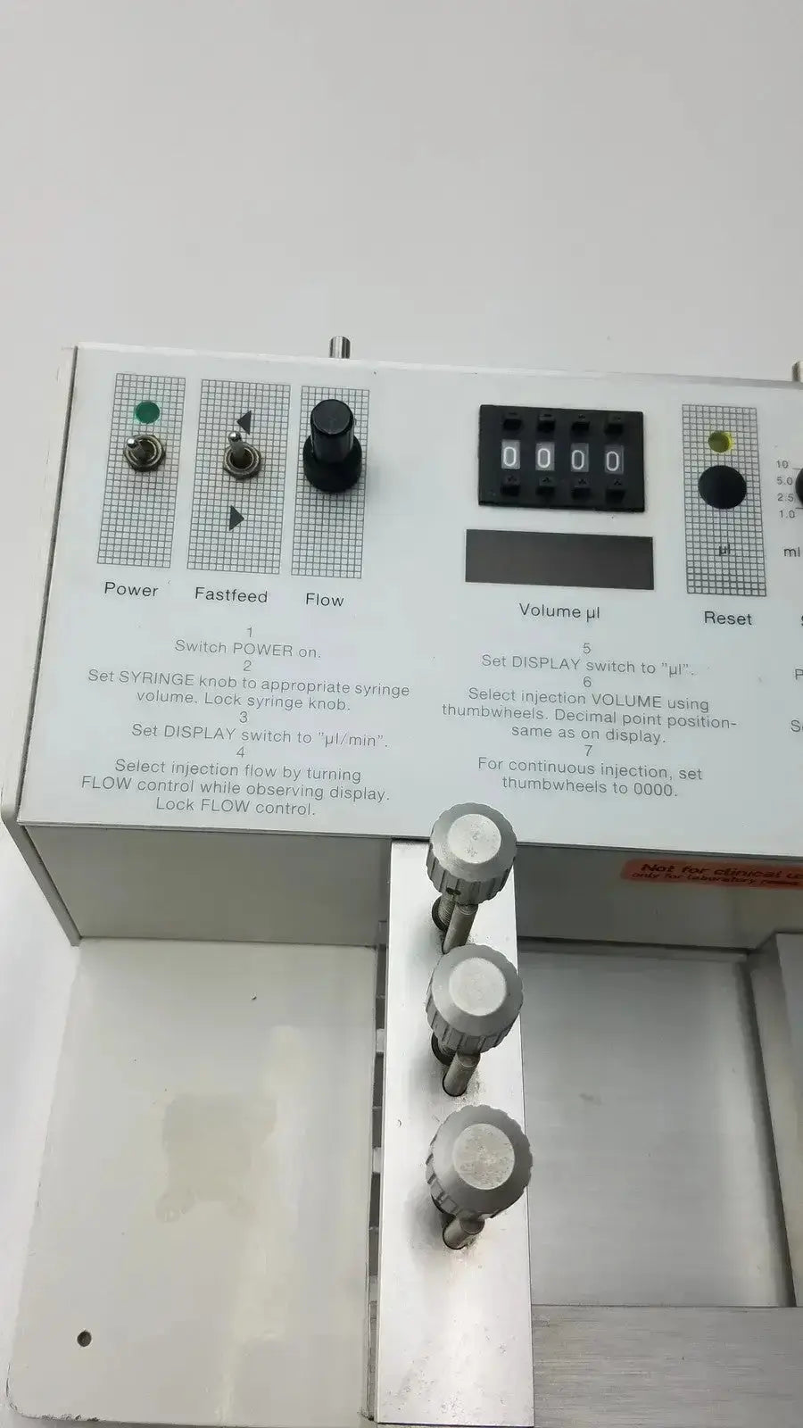 Silver metallic carnegie medicin ab model cma 100 microinjection pump with black knobs and digital display panel