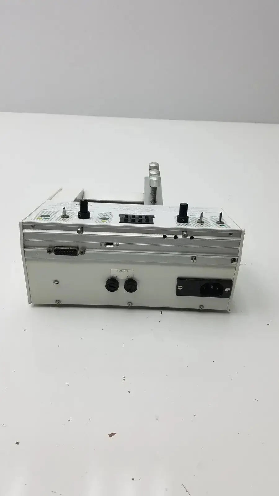 Silver metallic carnegie medicin ab model cma 100 microinjection pump with black knobs and ports in compact design