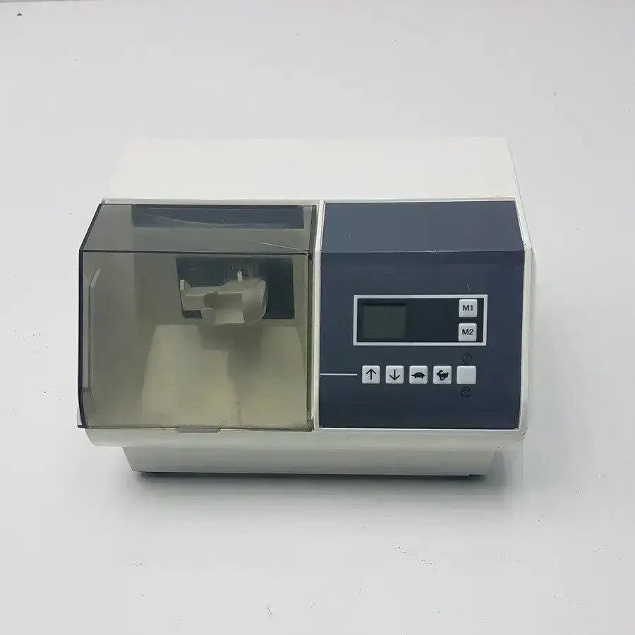 White and dark gray dentsply caulk promix 400 dental amalgamator with transparent acrylic chamber for precise mixing