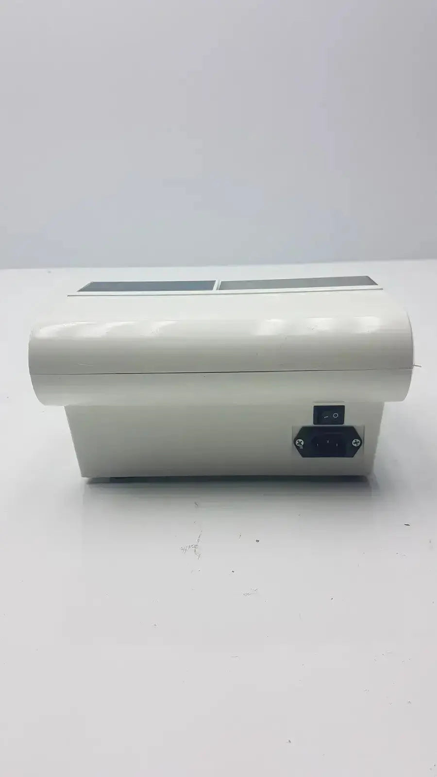 White plastic dental amalgamator dentsply caulk promix 400 with two rectangular slots and black side port g-cir-r4-12p