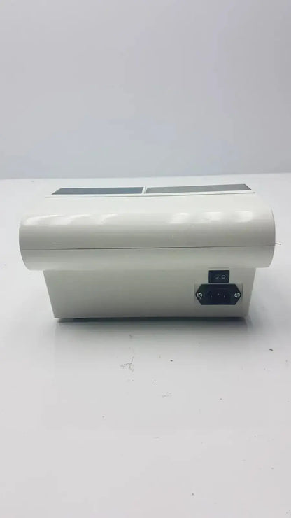 White plastic dental amalgamator dentsply caulk promix 400 with two rectangular slots and black side port g-cir-r4-12p