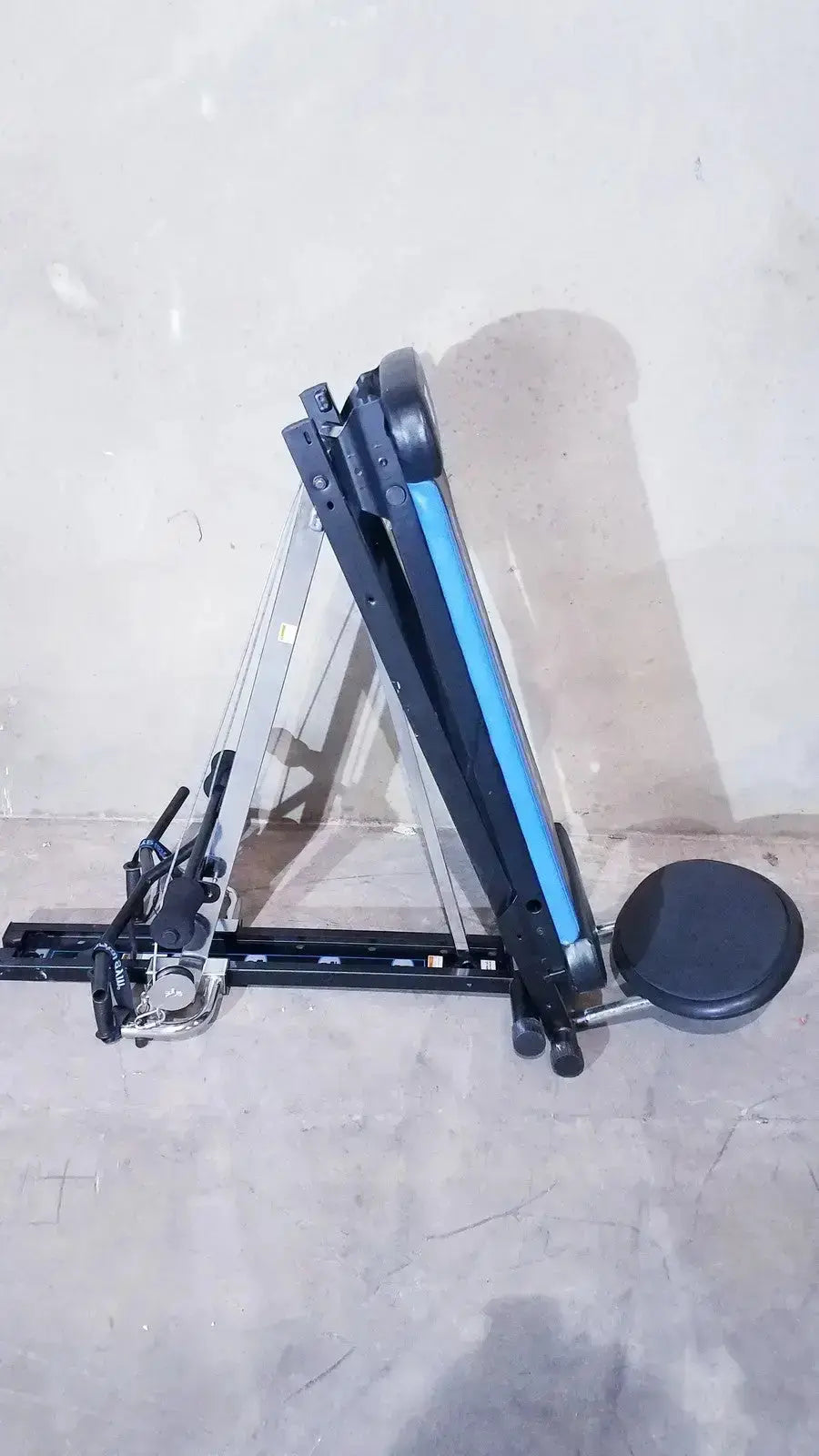 Black and blue foldable total gym xls exercise bench with adjustable weight resistance and foot stand wing bar