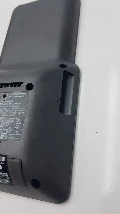 Black plastic expansion module with matte finish showing labeled specifications on back for cisco 8800 series kem audio cp-8800-a-kem