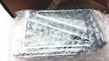 Silver-framed rectangular metal rack mount kit brackets wrapped in bubble wrap for cisco catalyst 3850 rack mount