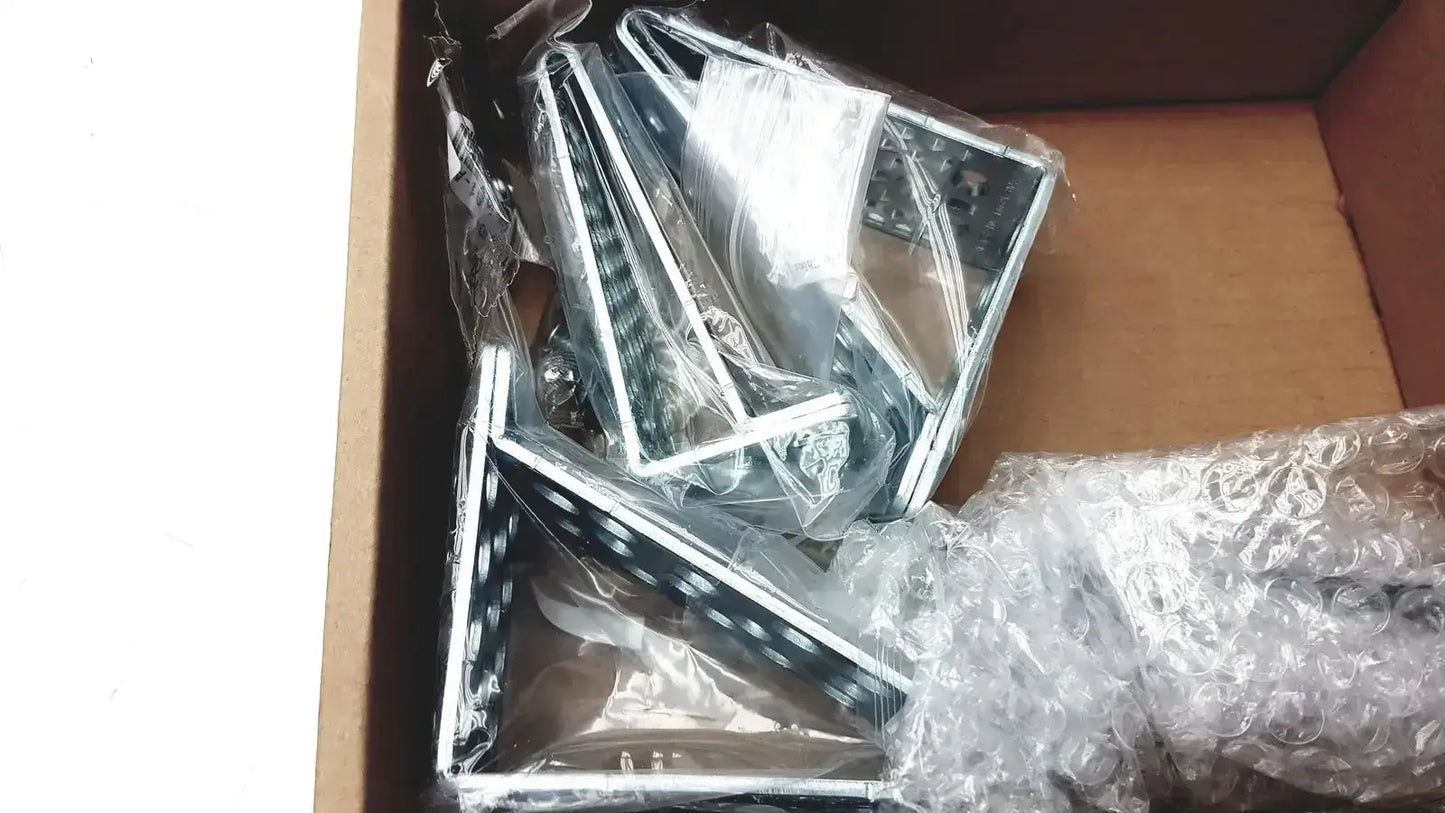 Silver-framed led light panels in clear plastic packaging with bubble wrap inside a box for cisco catalyst 3850 rack mount kit