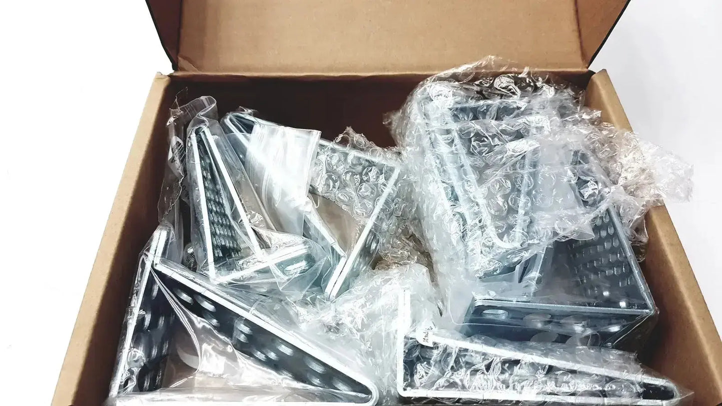 Silver triangular shelf brackets wrapped in bubble wrap inside a box for cisco catalyst 3850 rack mount kit
