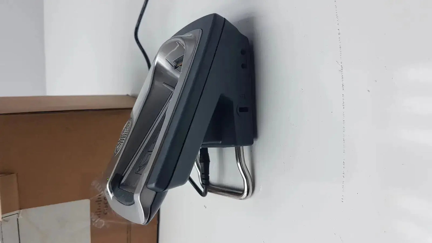 Black and silver wall-mounted cisco cp-7921g-a-k9 wireless phone with sleek modern design and base box included