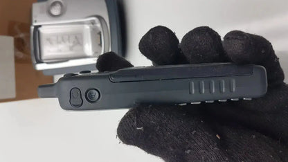 Black handheld cisco cp-7921g-a-k9 wireless phone with textured grip and two circular side buttons shown from the side