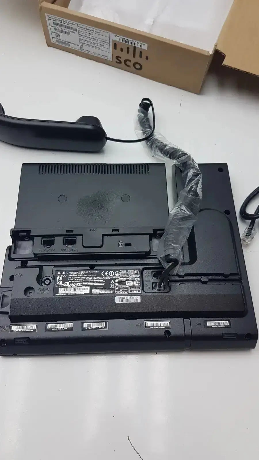 Black cisco cp-9971 ip color office phone base with coiled cord and attached handset for office use
