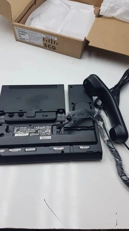 Black plastic Cisco CP-9971 color office phone with handset and cables for professional office phone use