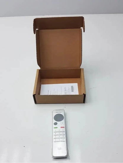 Silver cisco cts-rmt-trc6 remote control with circular touchpad and numbered buttons wrapped in clear plastic
