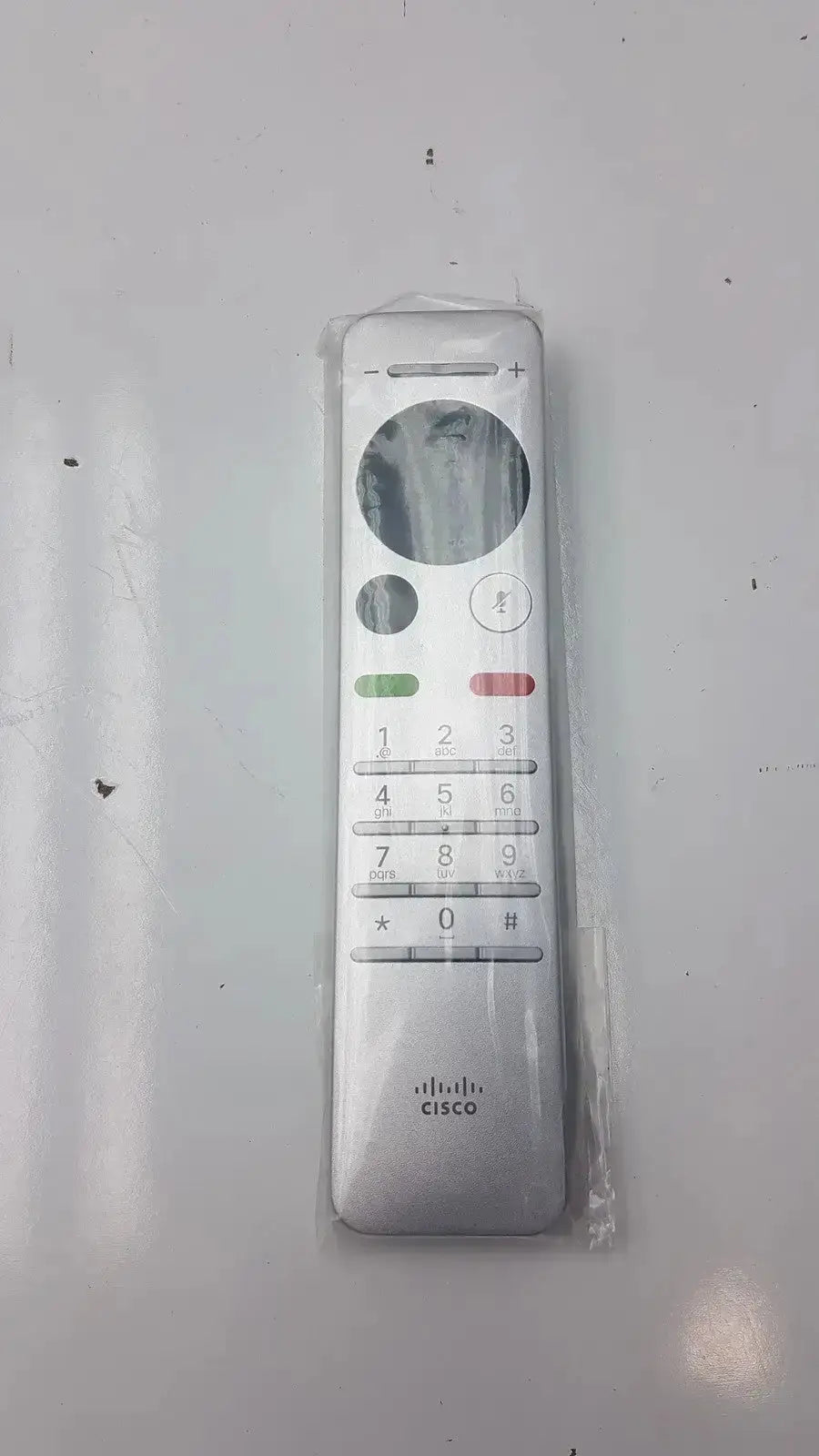 Silver cisco cts-rmt-trc6 remote control with circular navigation pad and numbered keypad for telepresence cts-sx20n