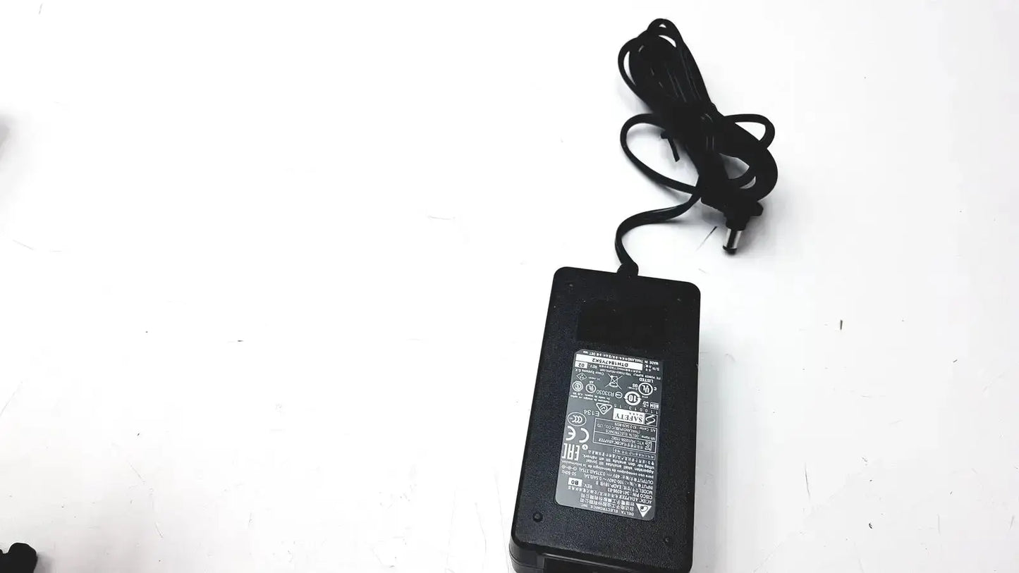 Black plastic cisco ip phone power supply cp-pwr-cube-3 with coiled black cable for phone power connection