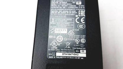 Black plastic cisco ip phone power supply cp-pwr-cube-3 with matte finish and printed safety certifications on back side