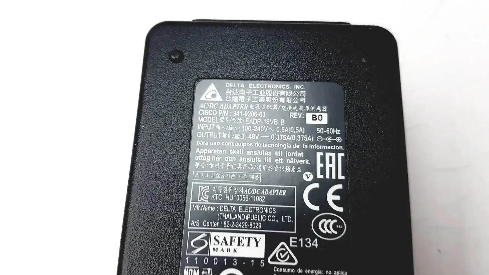 Black plastic delta electronics ac dc adapter with printed specifications for cisco ip phone power supply cp pwr cube 3