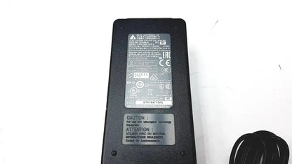 Black plastic Cisco ip phone power supply cp-pwr-cube-3 with coiled power cord for reliable phone power supply use