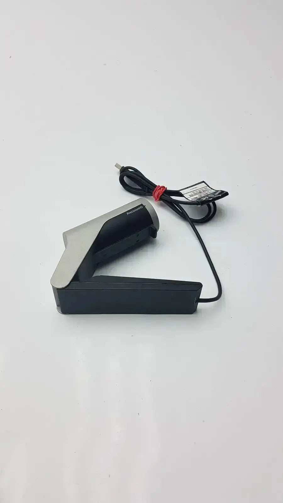Black and silver honeywell wireless barcode scanner with coiled cable tied by red band for cisco telepresence precisionhd use