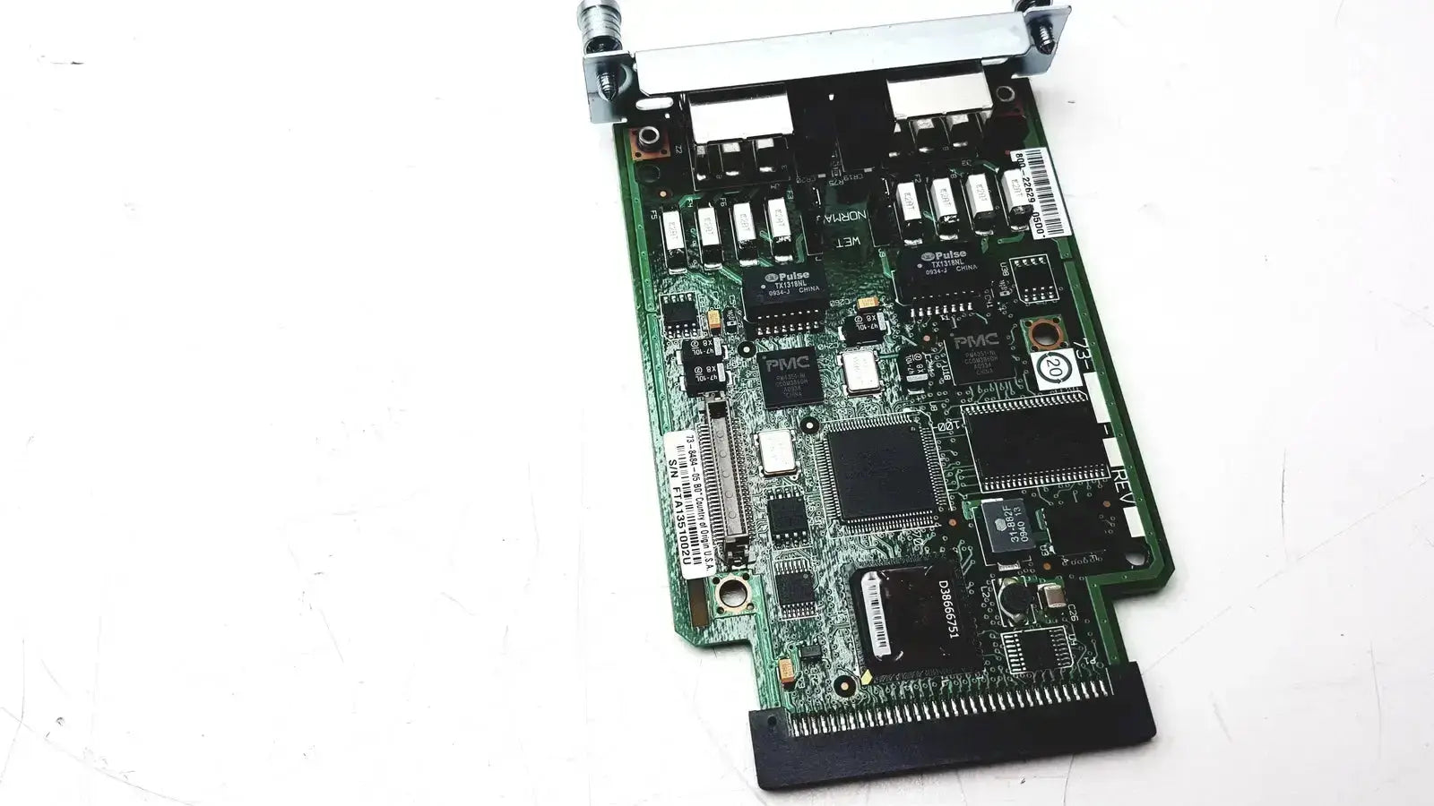 Green circuit board with black integrated circuits and silver connectors of cisco vwic2 2mft-t1 e1 2-port voice wan module