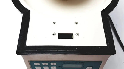 White and black plastic clay adams becton dickinson sero-fuge 2001 centrifuge device with keypad and four screws on top