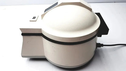 Cream-colored rounded desktop scanner with black accent and s label on side for clay adams becton dickinson centrifuge