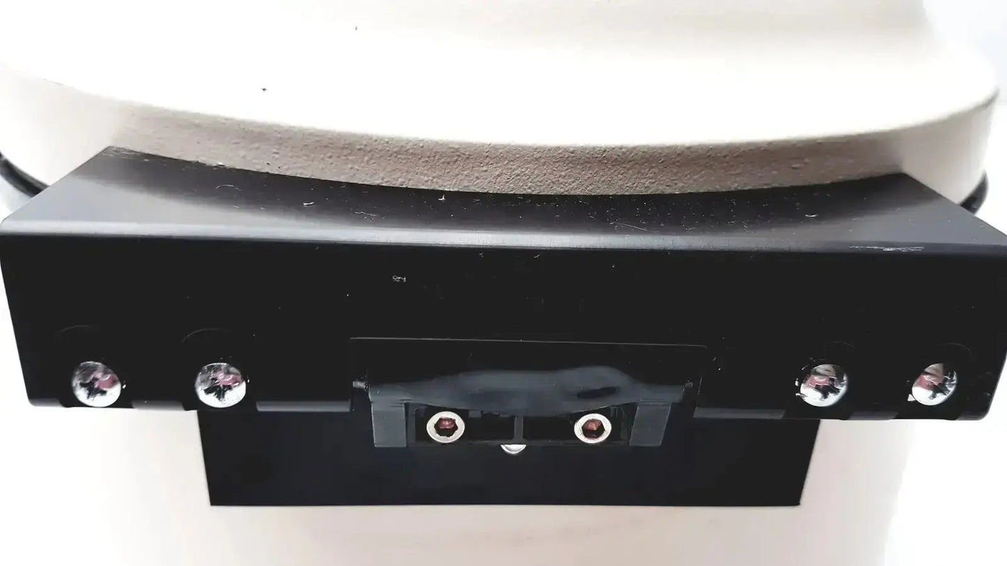 Black rectangular base with silver screws and two circular ports on the back of a clay adams becton dickinson sero-fuge 2001 centrifuge