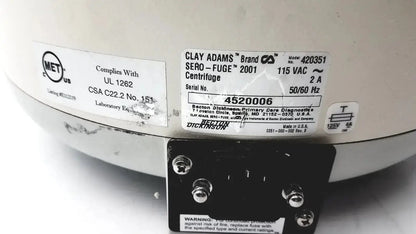 White ceramic Clay Adams benchtop centrifuge model 420351 with black metal base and labeled specifications