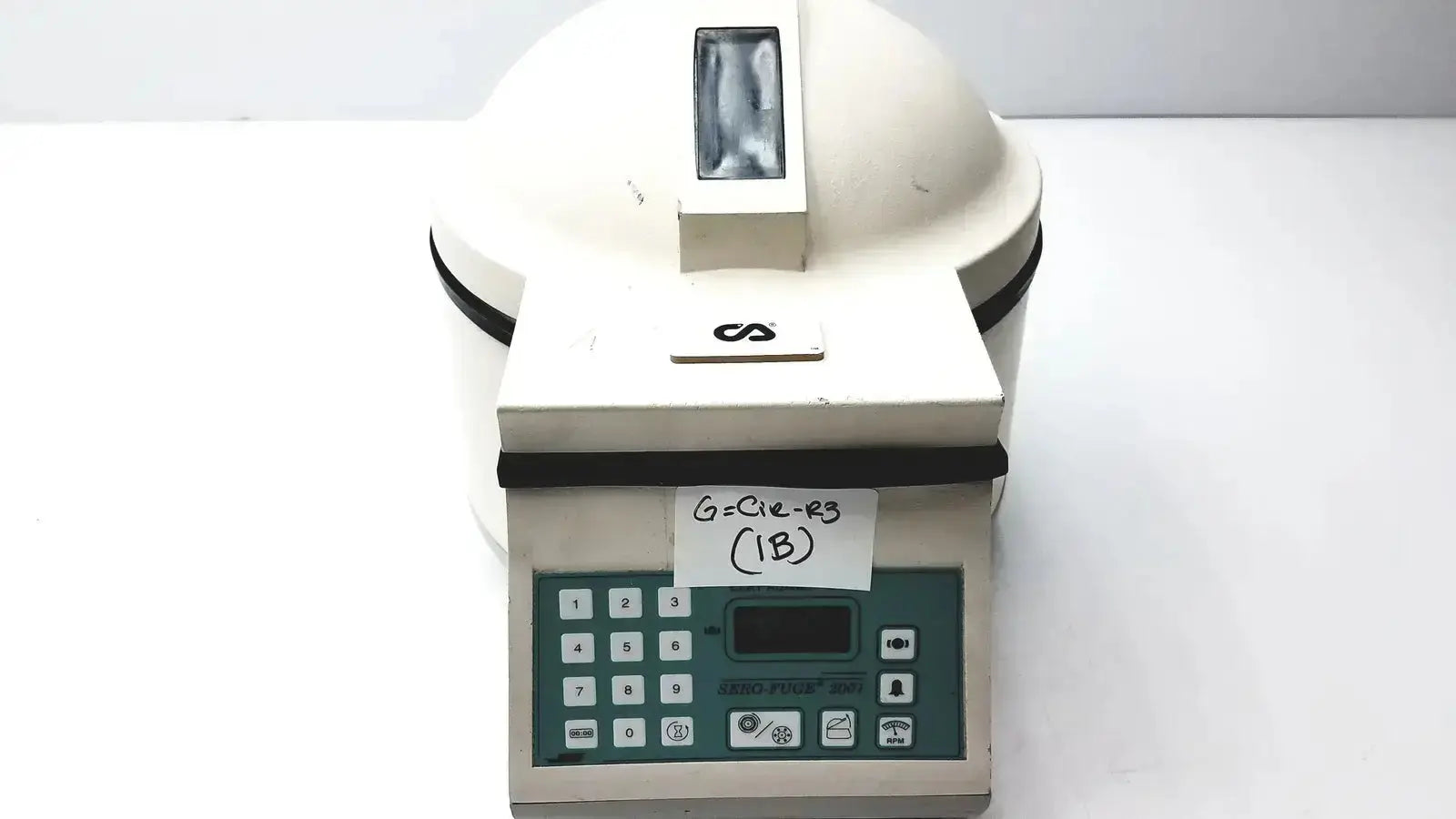 White clay adams benchtop centrifuge model 420351 with green control panel and black trim for laboratory use