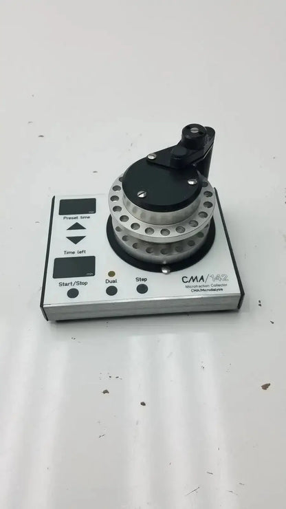 Silver and black cma microfraction collector model 142 with circular dial featuring multiple holes for precise microfraction control