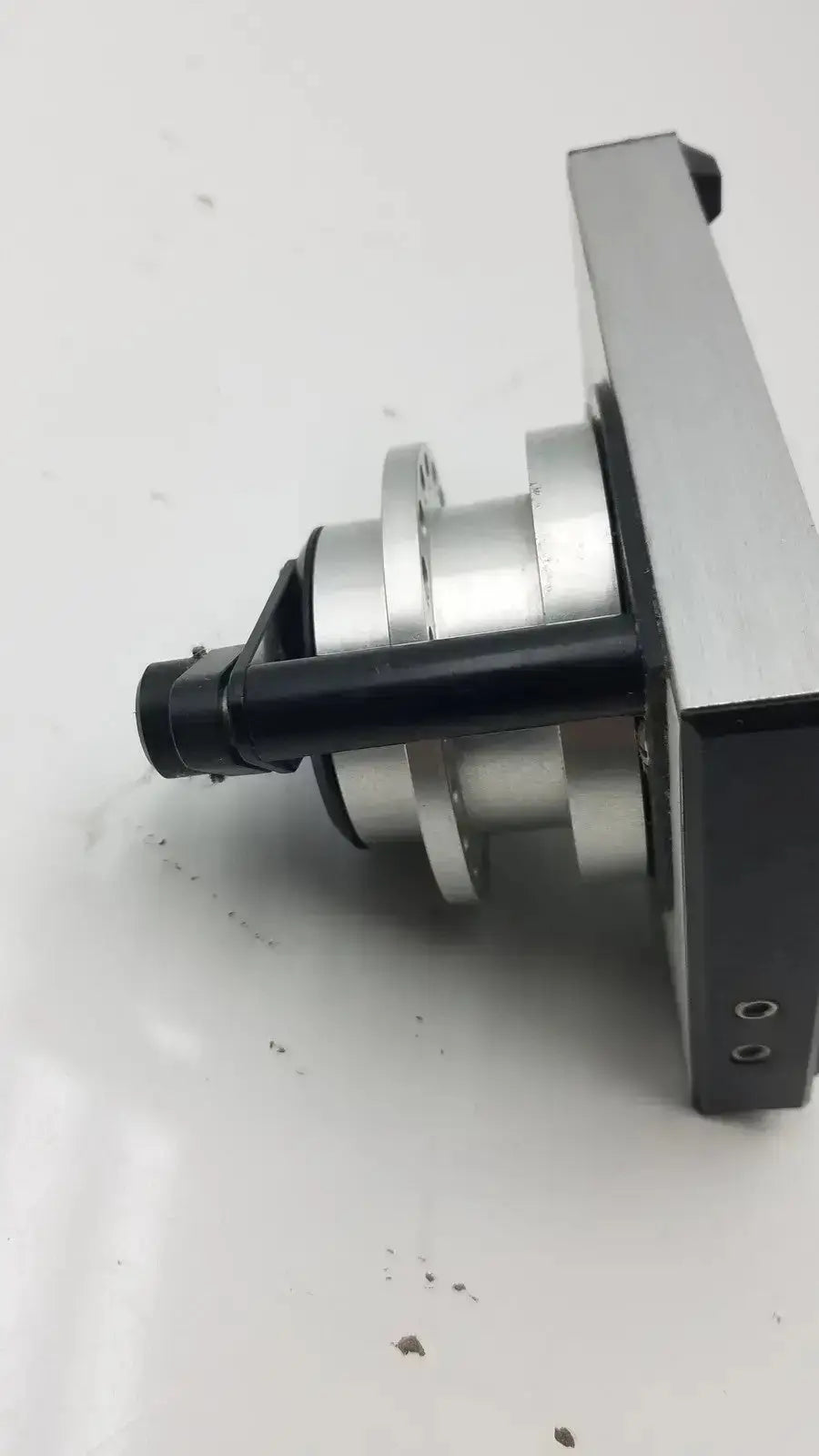Silver and black industrial clamp with cylindrical metal body and rectangular base for cma microfraction collector model 142