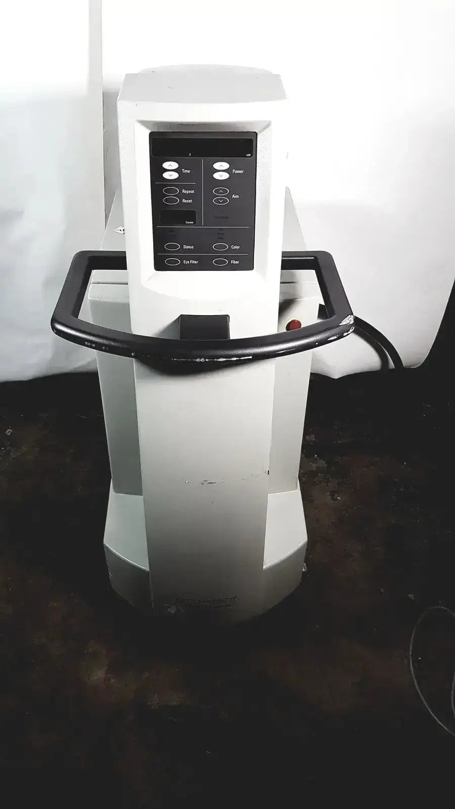 White medical-grade coherent novus omni ophthalmic photocoagulation laser system with black control panel and handle