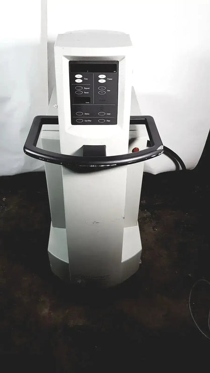 White medical-grade coherent novus omni ophthalmic photocoagulation laser system with black control panel and handle