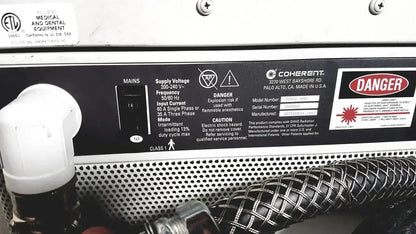 Coherent novus omni ophthalmic photocoagulation laser system panel with black label white text and warning symbols 220 volt