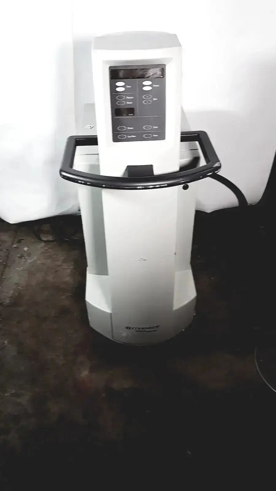 White medical-grade coherent novus omni ophthalmic photocoagulation laser system with black control panel and handle