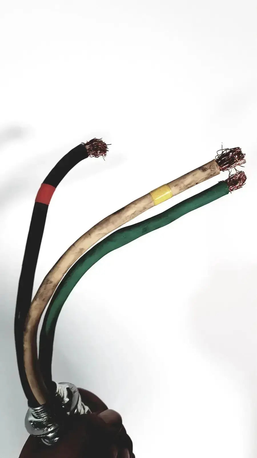 Three exposed electrical wires with frayed copper ends and metallic clamp on the back of coherent novus omni ophthalmic photocoagulation laser system 220 volt