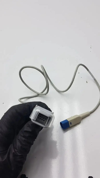 Gray compatible drager spo2 extension cable with clear plastic connector housing and blue-tipped end for spo2 extension use