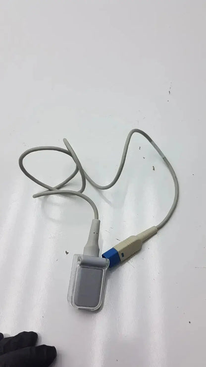 Gray medical pulse oximeter with clear plastic sensor housing and blue beige connector for spo2 extension cable use