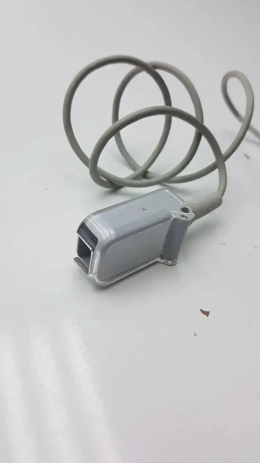 Gray plastic spo2 sensor with coiled gray spo2 extension cable compatible with drager extension cable model ad-d82db9-3f