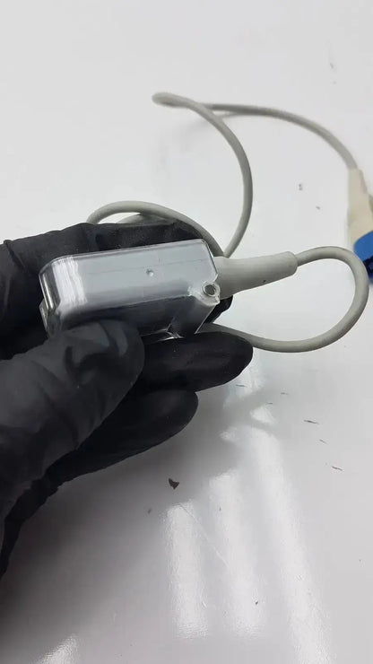 Gray plastic compatible drager spo2 extension cable with coiled cable and blue connector for spo2 sensor use