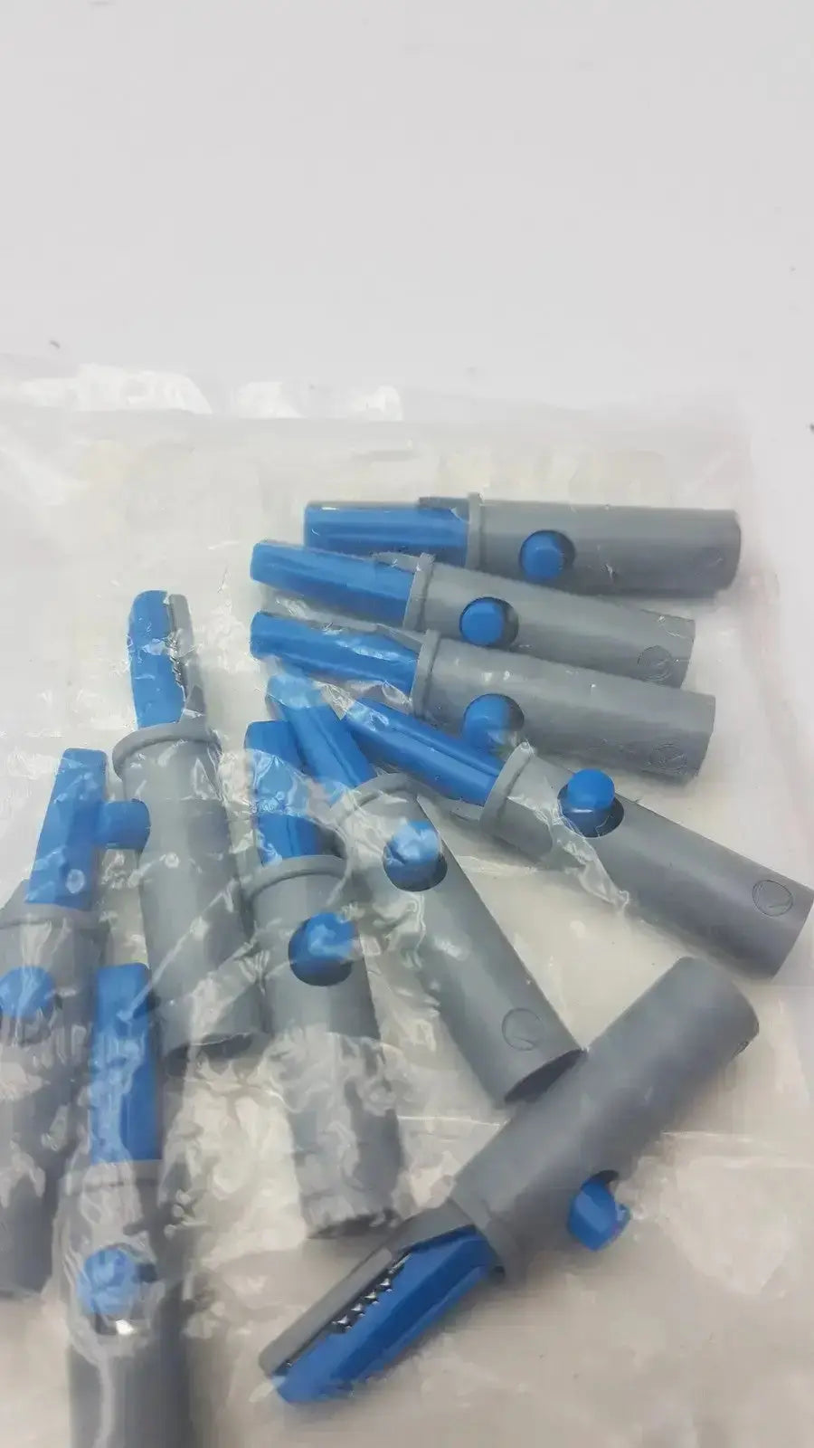 Gray and blue plastic conmed banana adapter with circular cutout on the side 10 pack ref hph blue