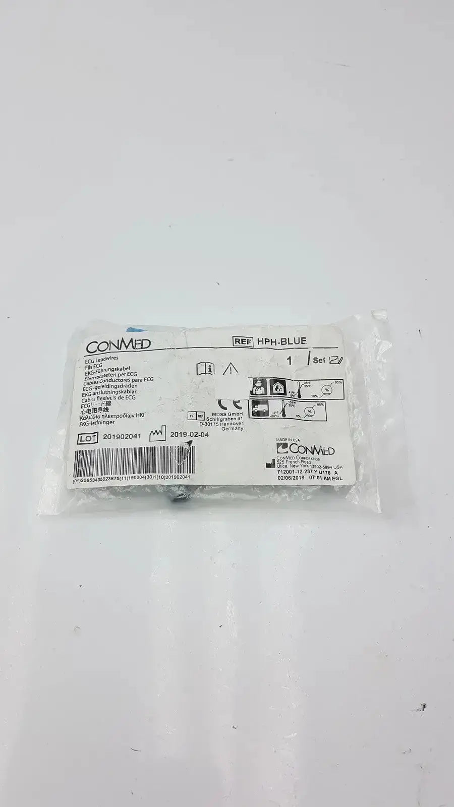 A sterile white plastic-wrapped package of conmed banana adapter medical devices in blue color ref hph-blue