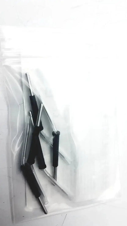 Black-handled precision screwdrivers with metallic shafts in a clear bag for conmed hyfrecator used medical equipment sale