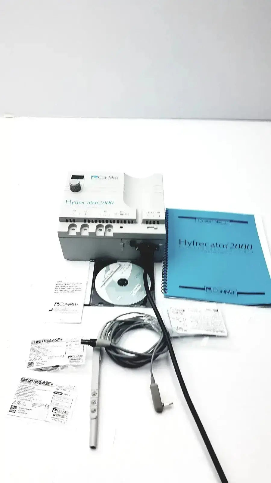 Gray and white conmed hyfrecator 2000 model 7-900-115 with black cables cd-rom and manuals used medical equipment for sale
