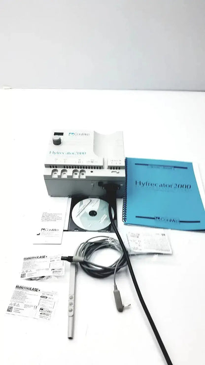 Gray and white conmed hyfrecator 2000 model 7-900-115 with black cables cd-rom and manuals used medical equipment for sale