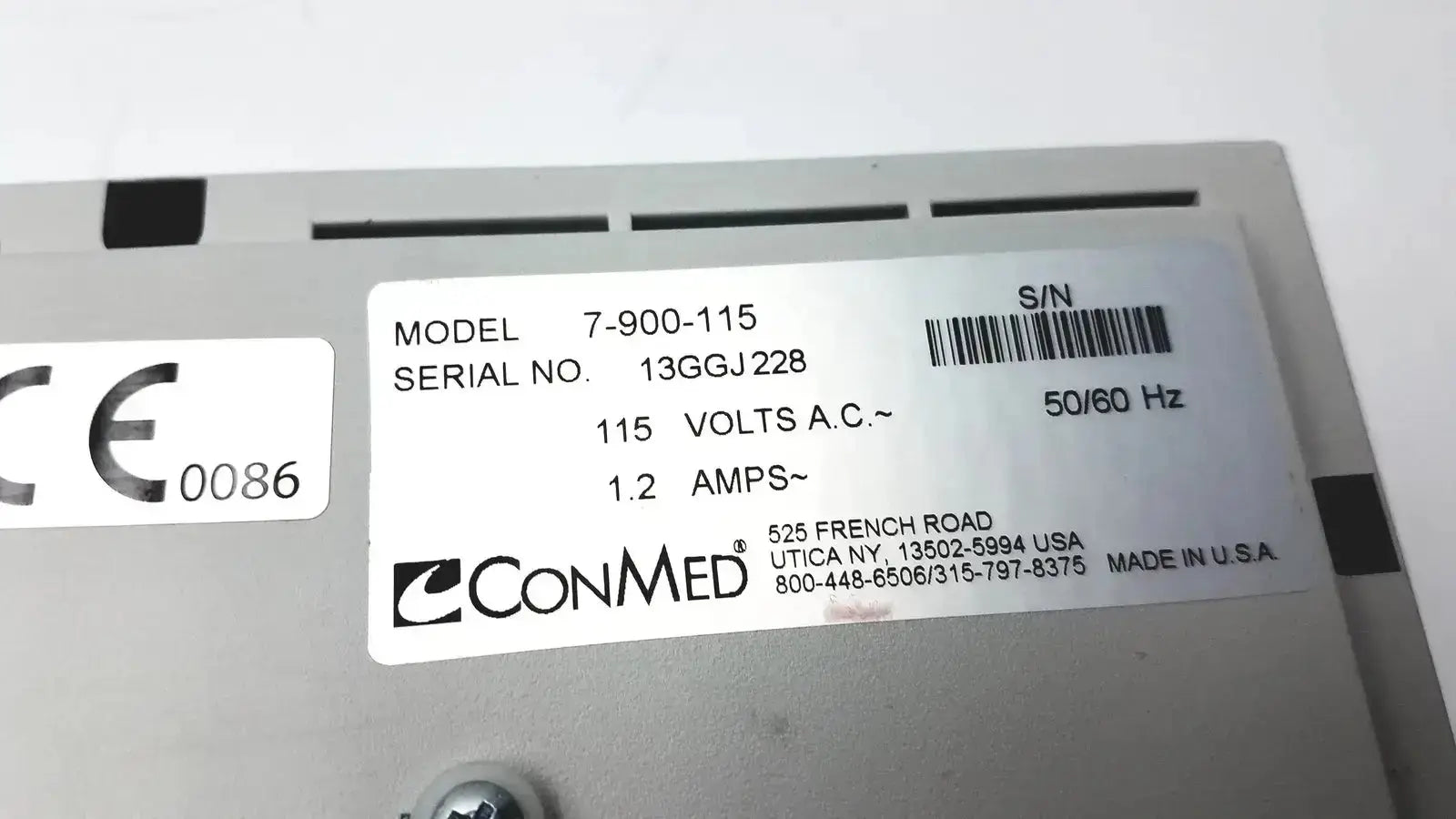 Gray metal conmed hyfrecator 2000 model 7-900-115 with white label showing serial and electrical specs back view used medical equipment for sale