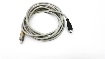 Gray control techniques connecting cable with one black connector and one gold-colored threaded connector