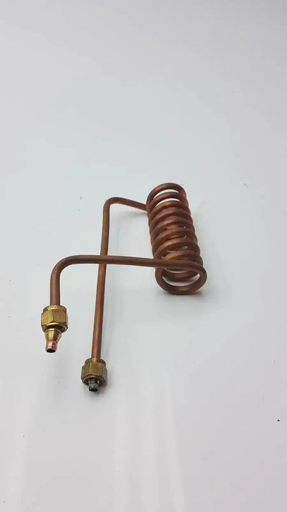Copper-colored coiled fin tube coil heat exchanger with brass fittings made of copper nickel fin material