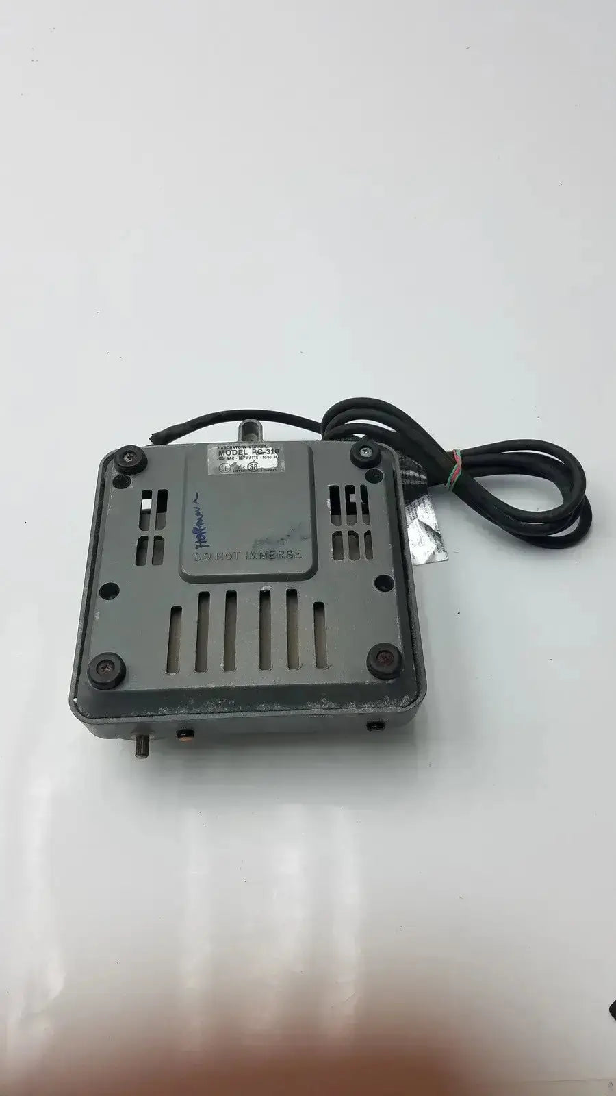 Gray plastic digital signal converter with black power cord and ventilation slots on the back of corning laboratory stirrer rc-310