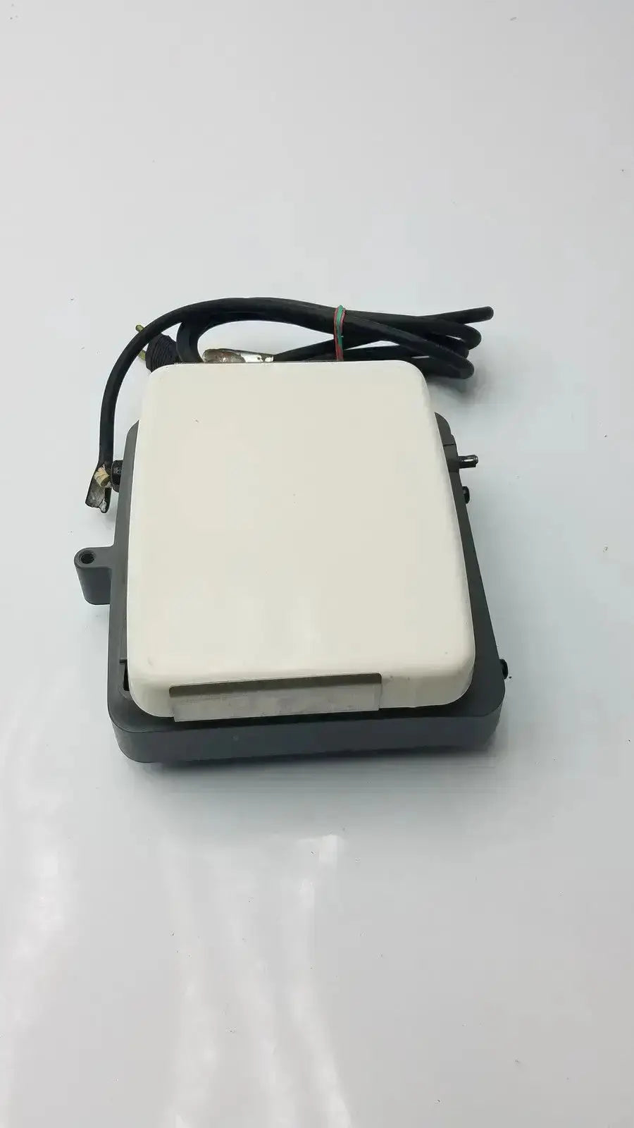 White rectangular outdoor wireless router with black cable and mounting brackets featured on corning laboratory stirrer model rc-310