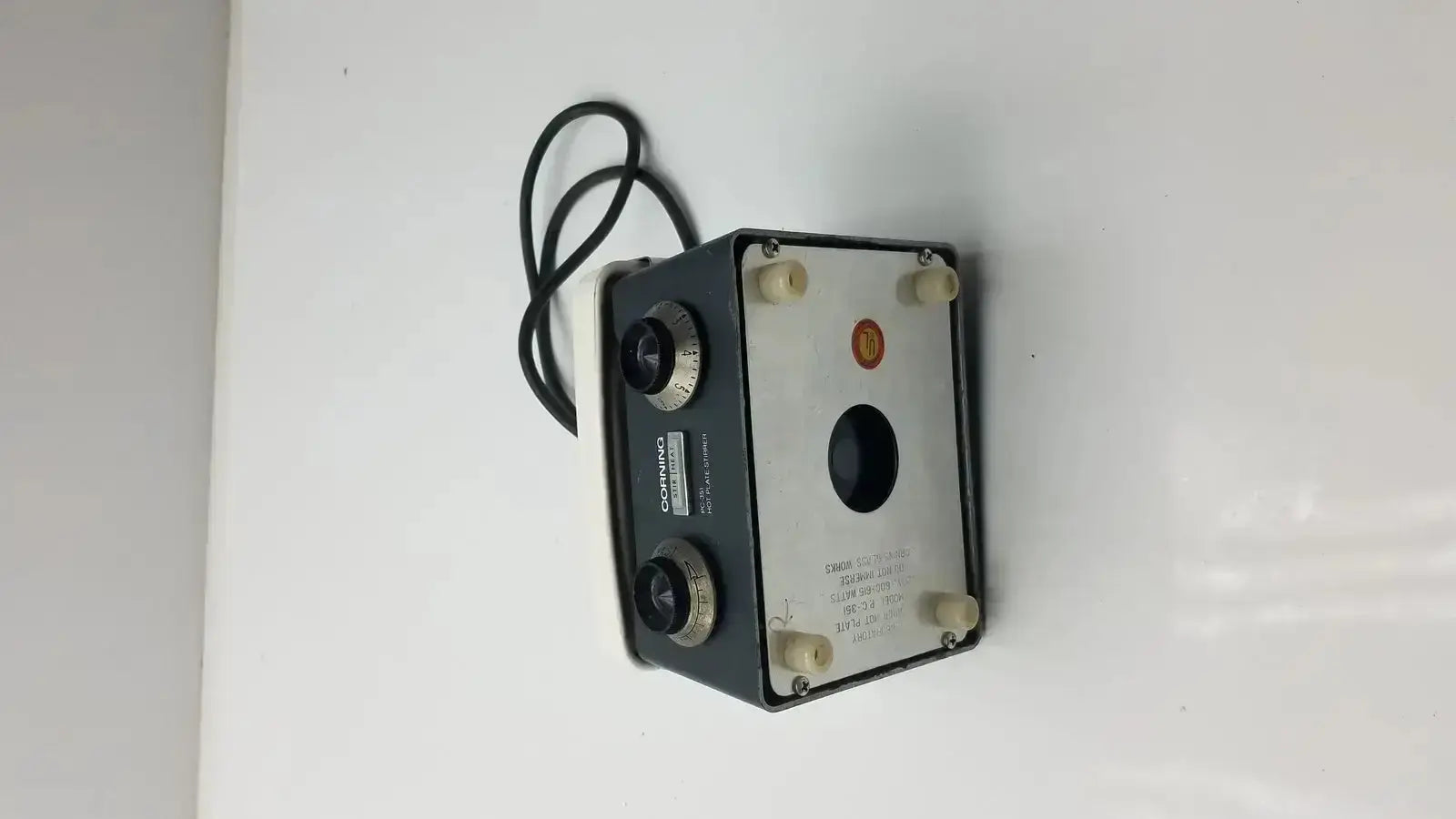 Corning pc-351 laboratory hot plate stirrer with black and silver dual-lens camera and coiled black cable attached